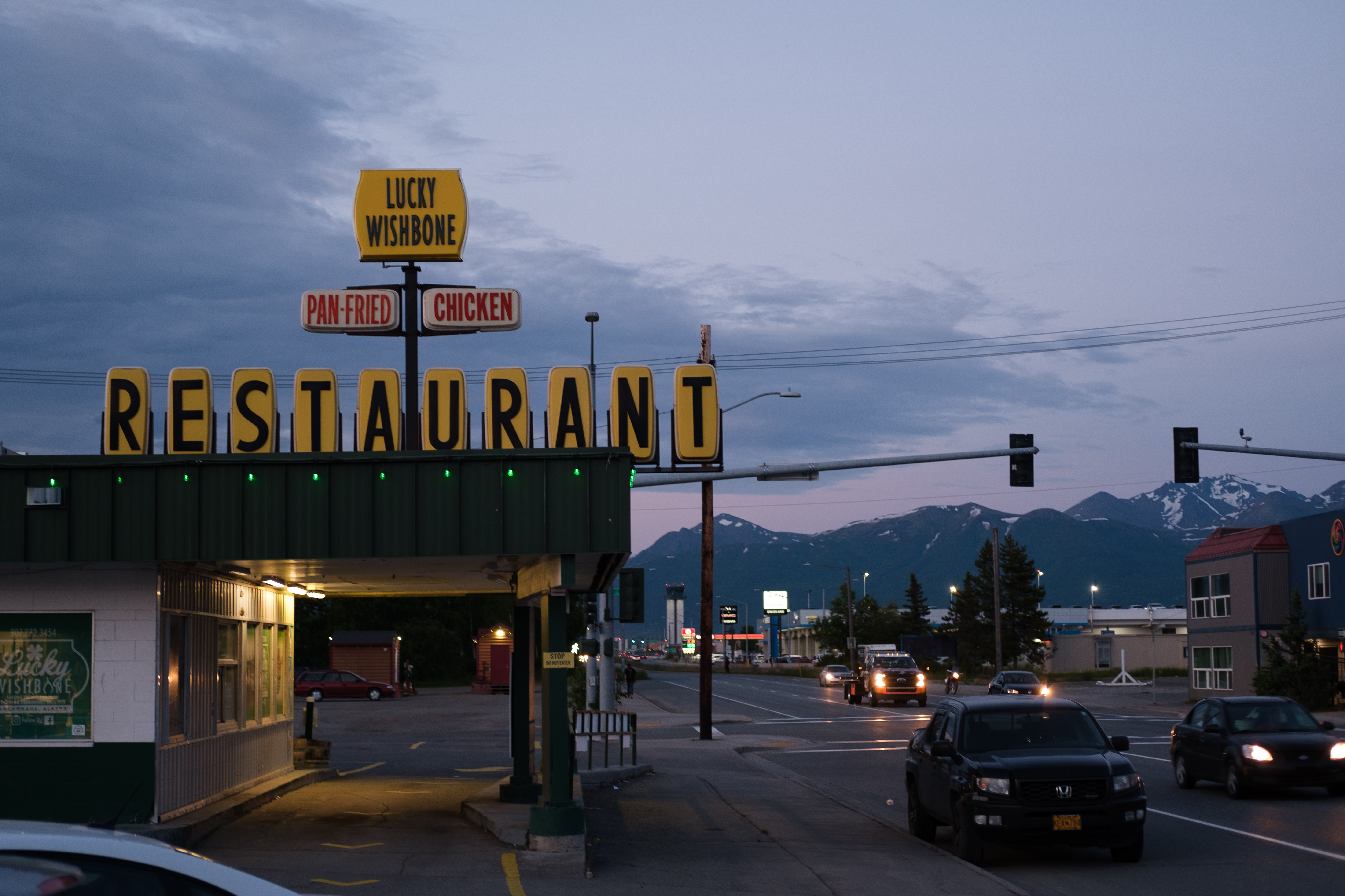 Dusky photo of Lucky Wishbone diner at midnight on summer solstice in Anchorage, AK 2024